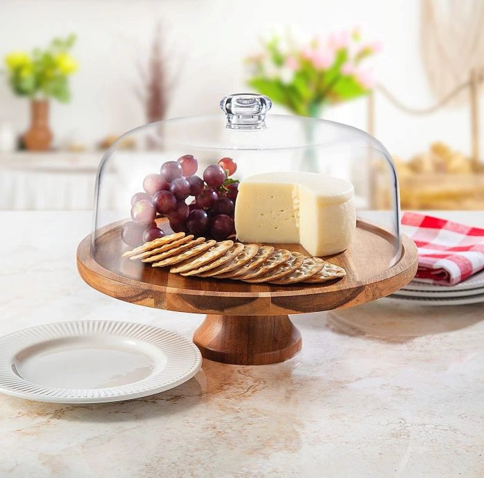 A cake stand featuring an assortment of charcuterie