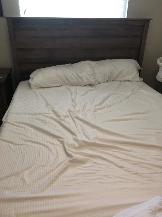 Loose sheets draped over a bed