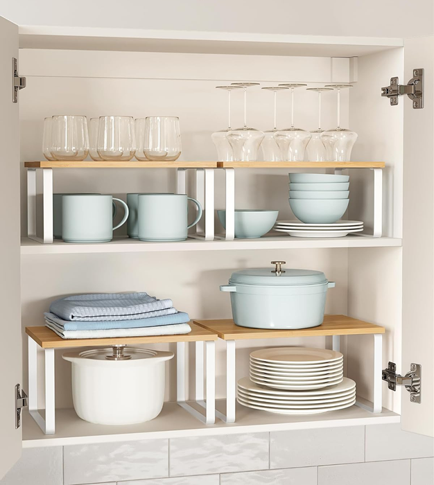 The organizers placed inside a cabinet, storing dishes, bowls, and other items vertically for optimal space management