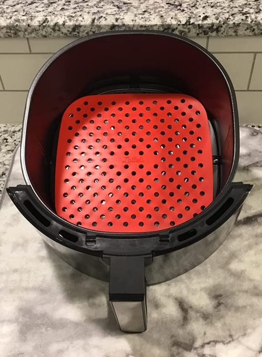 A reviewer's red air fryer liner.