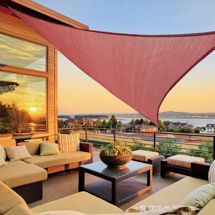 A sail canopy draped over a patio area, providing shade and comfort.