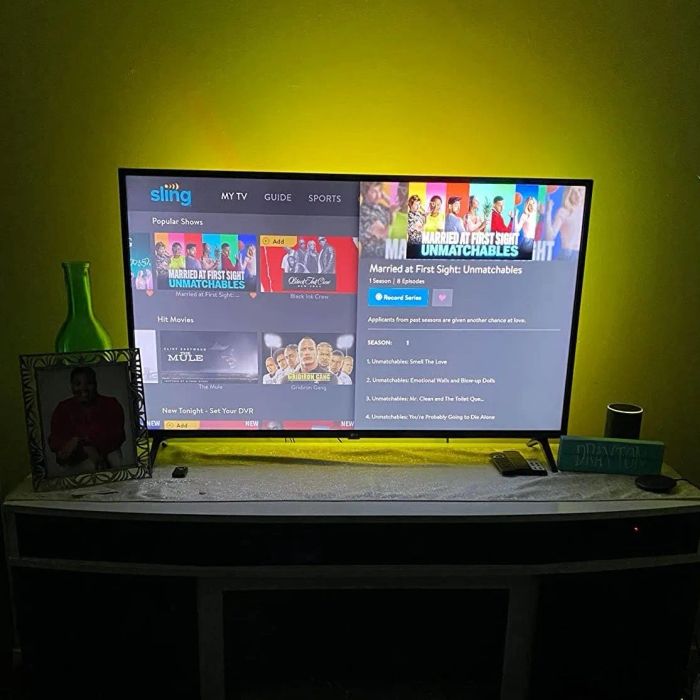 The same reviewer shows off the LED lights now glowing in yellow.