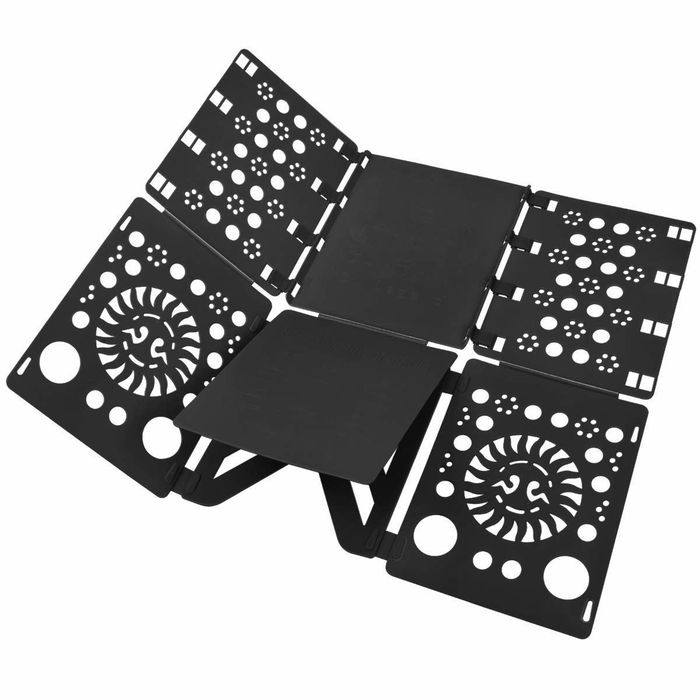 A black folding board used for organizing laundry