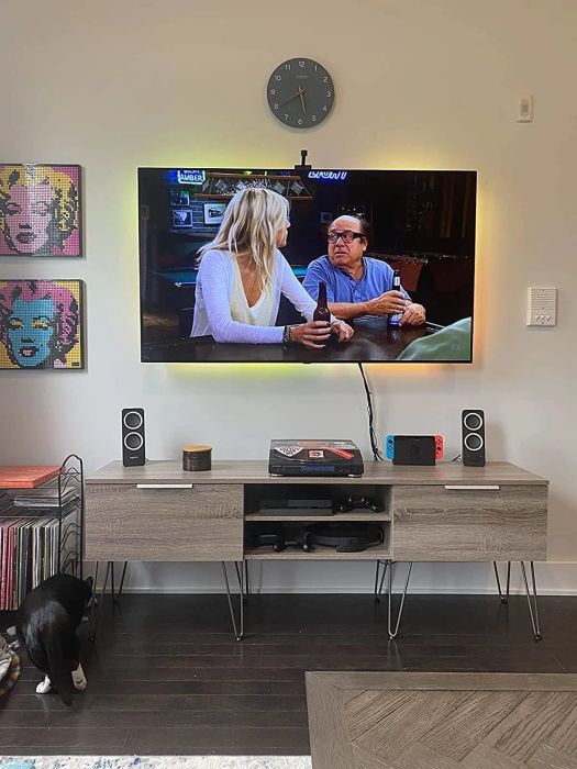 The same reviewer's TV stand, now with stylish hairpin legs added for a fresh look.