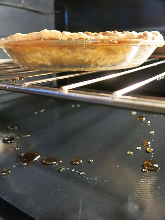 An oven with protective liners keeping the bottom safe from spills and crumbs.