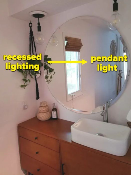 A reviewer's bathroom showcasing the transformation from recessed lighting to pendant lighting using the conversion kit.