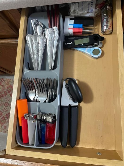 The same reviewer’s after image showing the newfound space saved by the cutlery tray