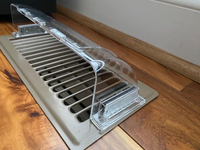 Side view of the clear magnetic vent clip