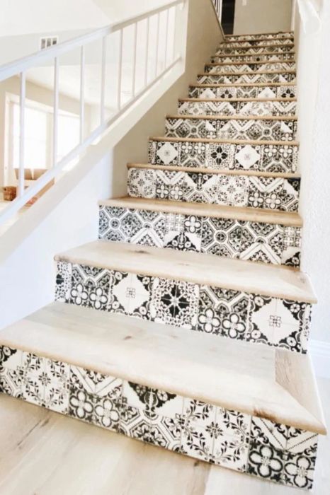 A reviewer's image showing peel-and-stick paper applied to stairs, transforming the look instantly.