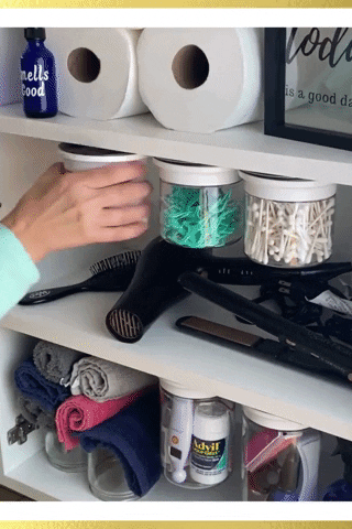 A gif showing someone moving the canisters and grabbing a cotton ball.