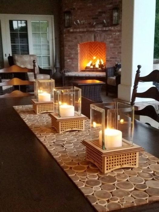 The wooden tabletop fireplace used as a candle holder