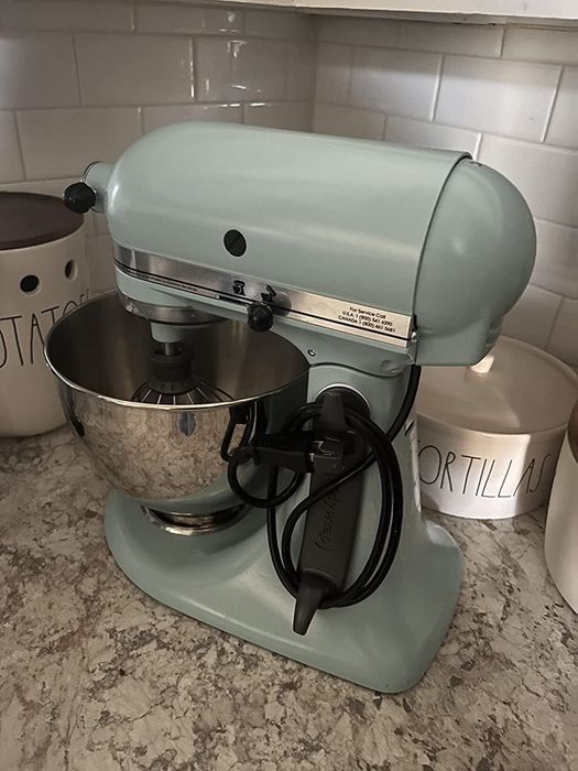 A reviewer's image showing the cord organizer attached to a KitchenAid mixer