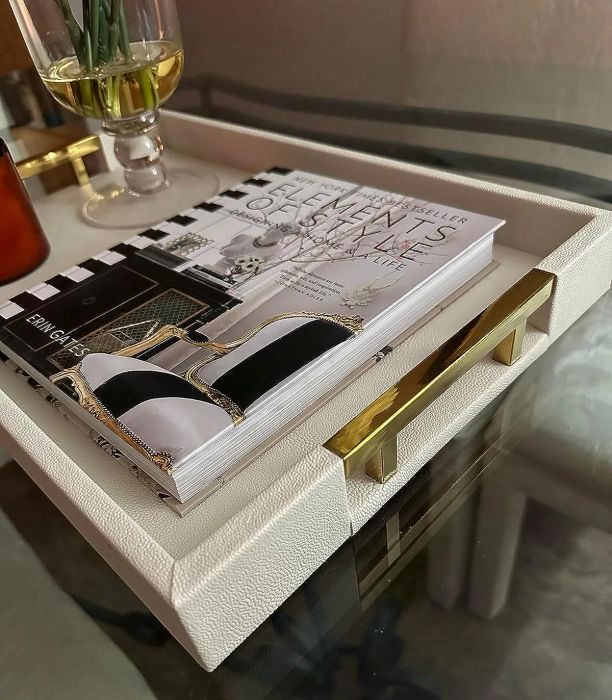 A close-up of the same reviewer's tray, highlighting the gold handle and the fabric texture details.