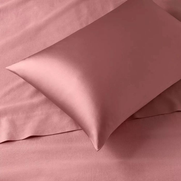 Close-up of a silk pillowcase and sheets