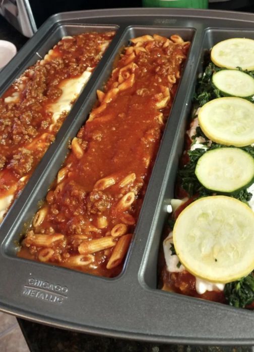 A customer review photo showing their pan with three distinct types of lasagna