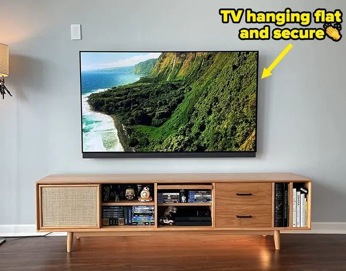 A reviewer's TV mounted flat on the wall, showcasing a clean look.