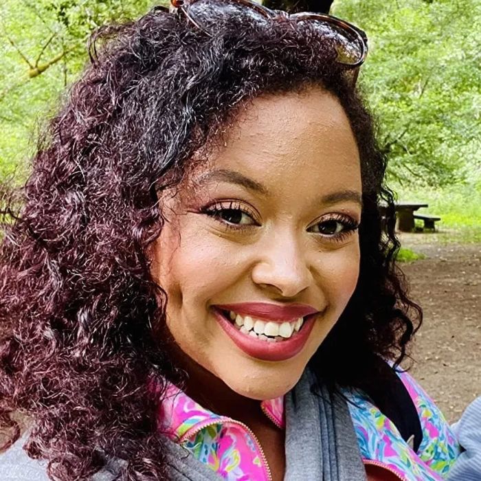 A reviewer showing off their natural curly hair