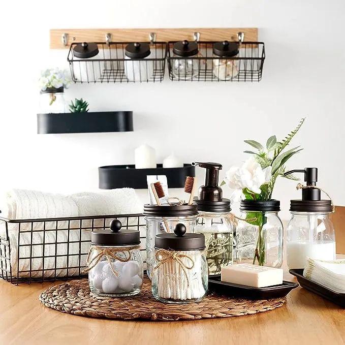 The mason jar set showcasing various bathroom accessories inside.