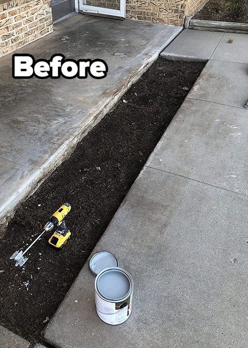 A reviewer photo showcasing a concrete patio and sidewalk before painting