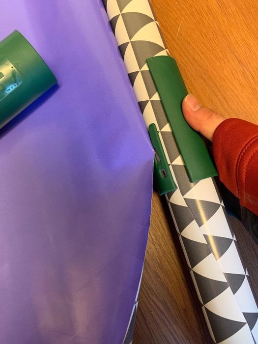 Reviewer using the cutter to slice wrapping paper