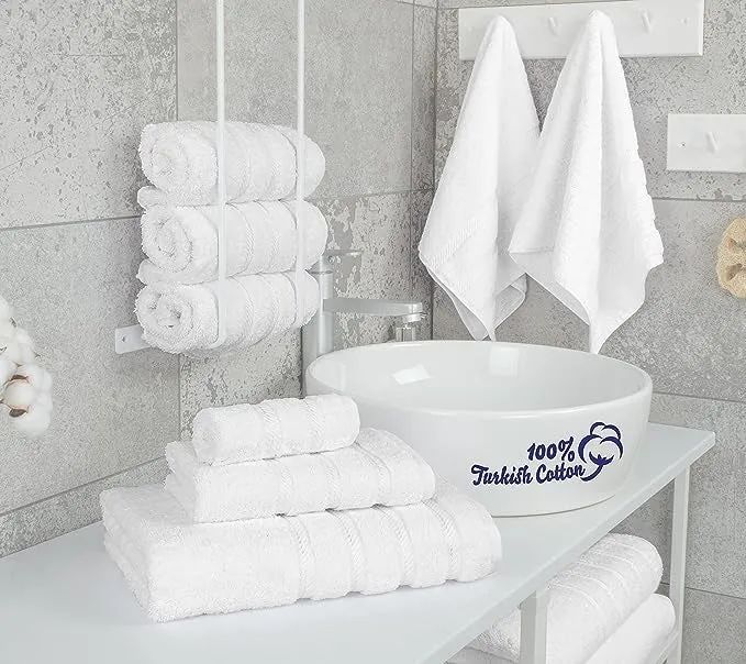 The full set of six white towels neatly arranged.