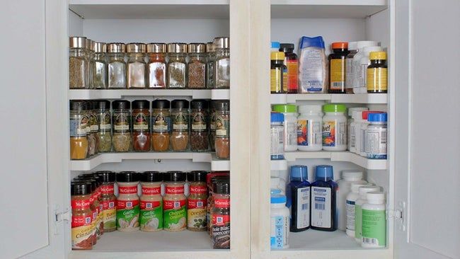A u-shaped shelf filled with various spices.
