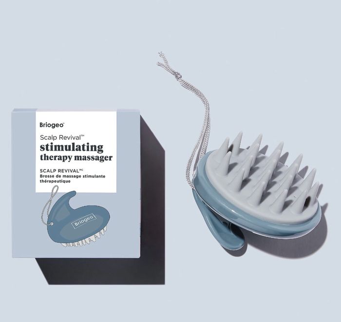 Briogeo Scalp Revival Stimulating Therapy Massager with box, showcasing soft bristles and a string handle, designed for optimal scalp care
