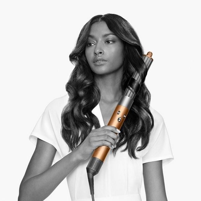 Model using the curl attachment of the Dyson Air Wrap.