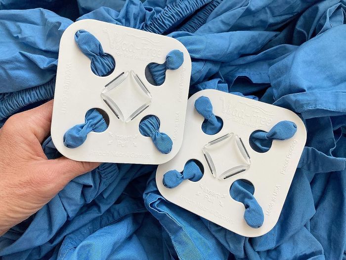 the wad-free pads attached to a bed sheet