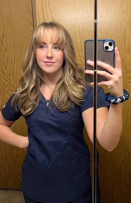 A reviewer with perfectly blown-out, loose curls.