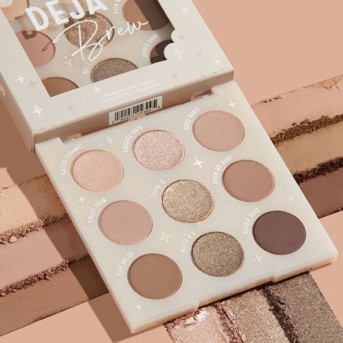 Top view of an open eyeshadow palette named 'Deja Brew' featuring nine different shades
