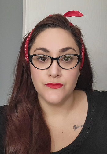 The same reviewer wearing the vibrant liquid lip tint, enhancing their lips with rich color.