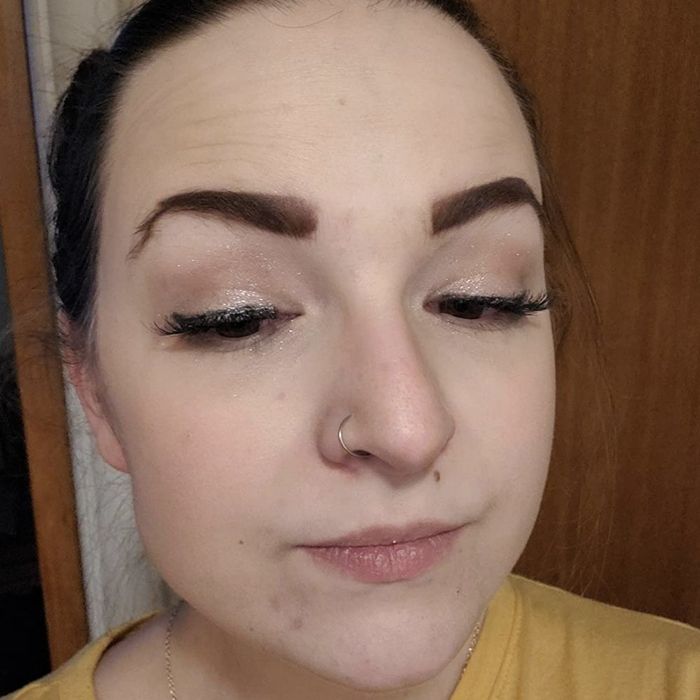 A person applying foundation after using the mattifying primer before a 12-hour shift