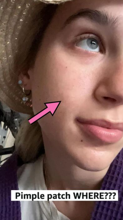 A close-up of a reviewer’s face with clear skin, with a pink arrow pointing to her cheek. Text below reads: