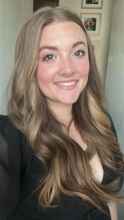 A reviewer showing off the blush after application