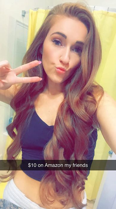 The same reviewer revealing voluminous curls the next morning after using the curler