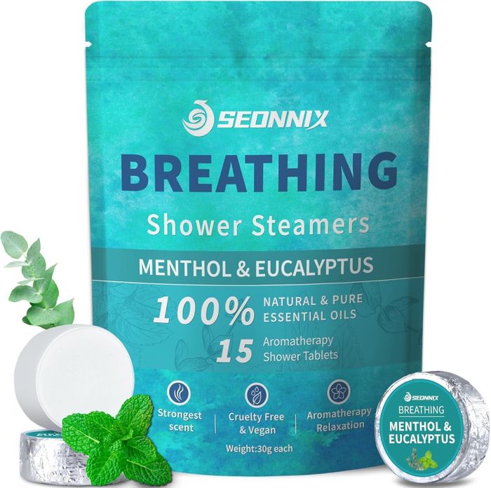 Packaging for Seonnix Breathing Shower Steamers with menthol and eucalyptus, 15 tablets, an aromatherapy product. Includes illustrations of leaves and steamers.