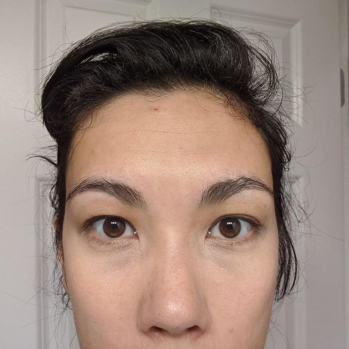 The same reviewer after applying the concealer, with their under-eye area visibly brightened.
