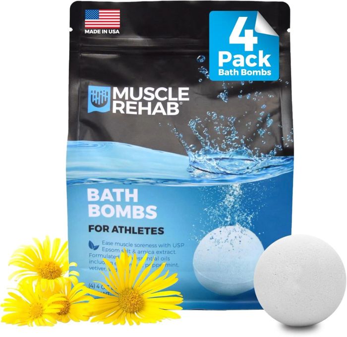 A package of Muscle Rehab Bath Bombs, featuring daisies and a bath bomb designed for athletes. Made in the USA, 4-pack. Helps ease muscle soreness with USP Epsom salt and arnica extract.