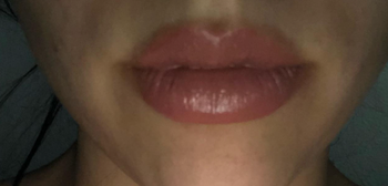 Same reviewer's lips, visibly fuller after applying the lip plumper