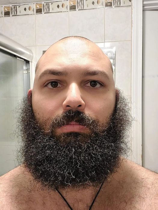 a reviewer's beard before using the straightener, all curly and unruly