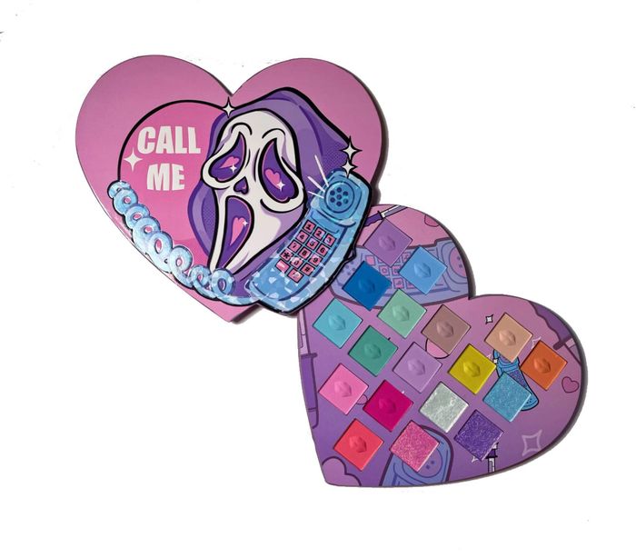 The Ghostface palette is opened to reveal its vibrant array of eye shadows, ready to transform any makeup look.