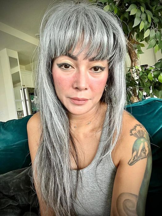 A reviewer showcasing the blush oil in use