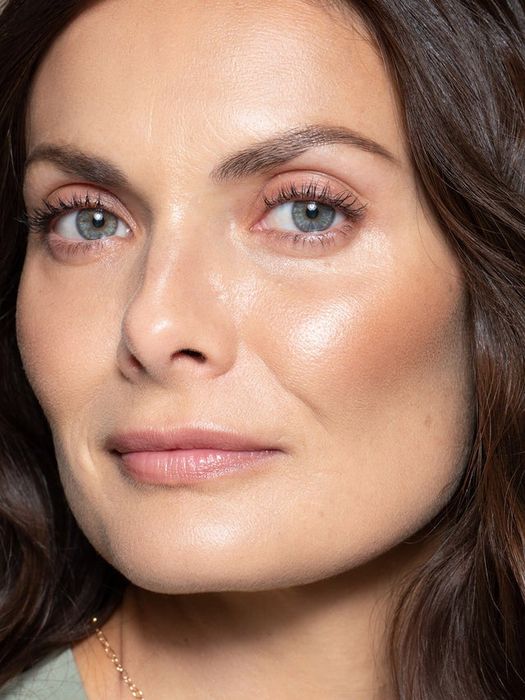 Another model sporting a shimmering gold shade as a highlighter