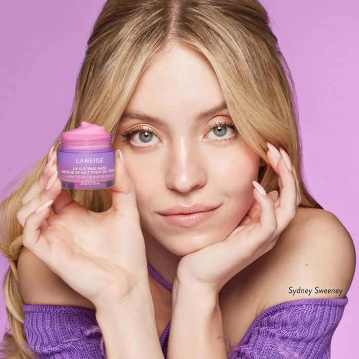 A person holding a jar of Laneige lip mask