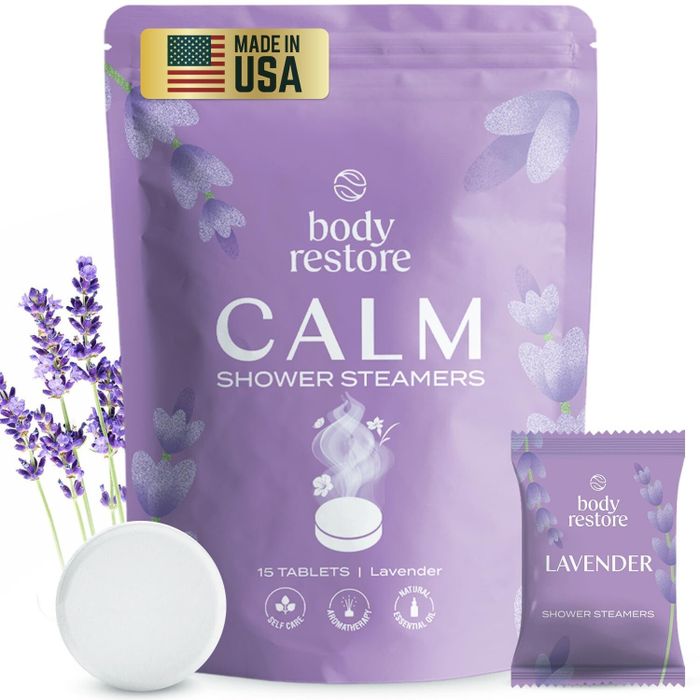 Package of Body Restore Calm Lavender Shower Steamers with 15 tablets, featuring an image of a lavender sprig and a 'Made in USA' label.