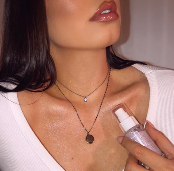 A person wearing the shimmer oil