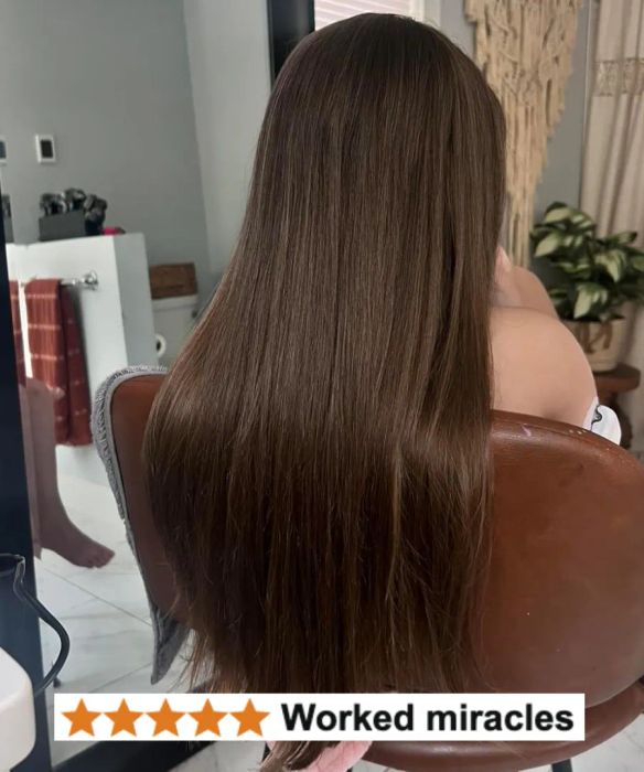 A person in a salon chair with smooth, long hair, accompanied by a 5-star review reading: