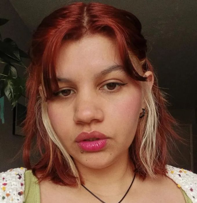 The reviewer showcasing the lip tint