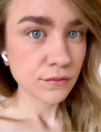 A reviewer without mascara on their lashes.